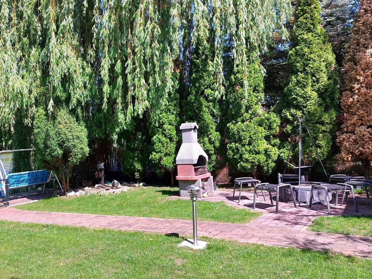The garden oven and outdoor dining table among the pines