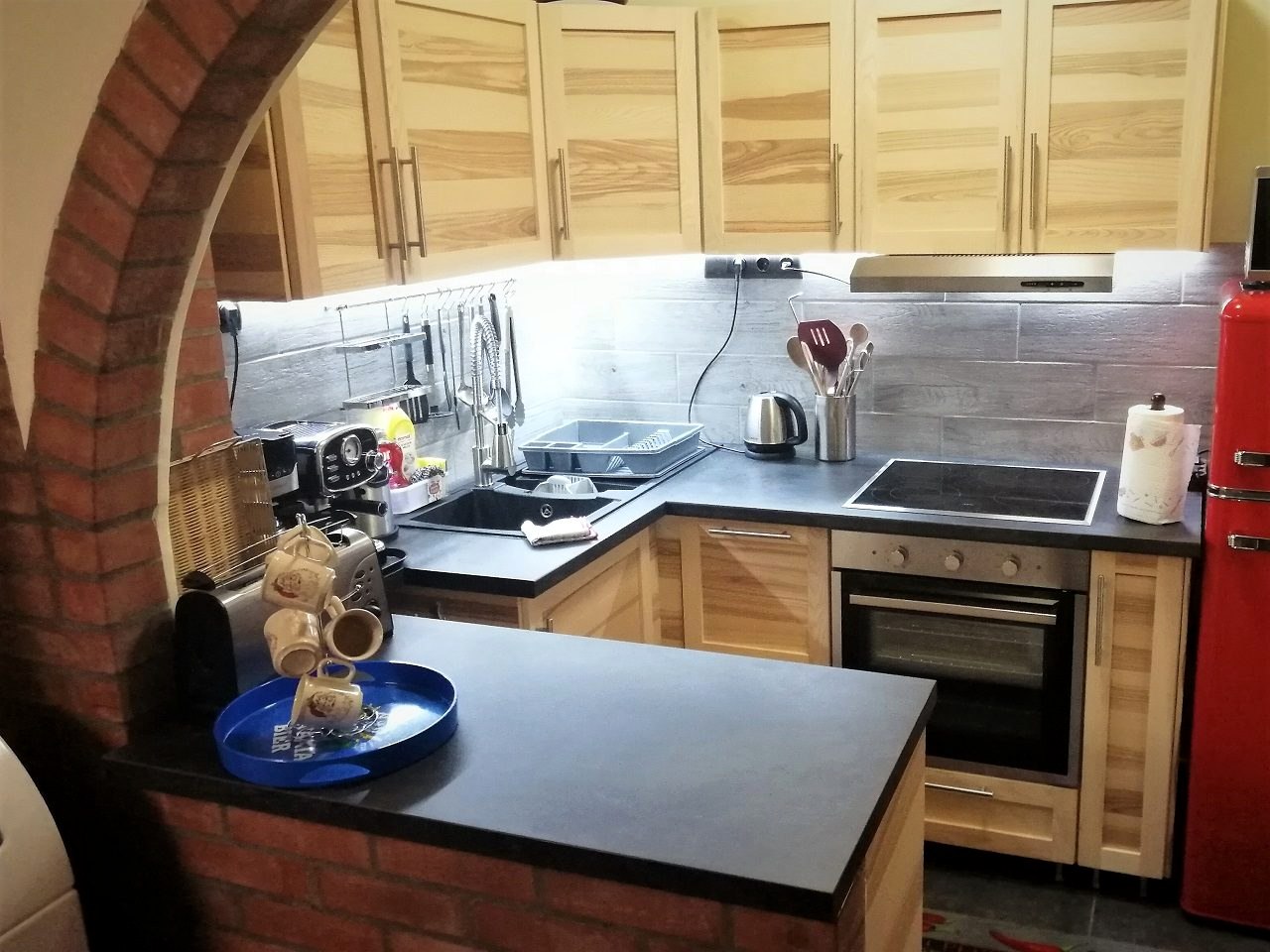 The kitchen under the arch, with a ceramic hob