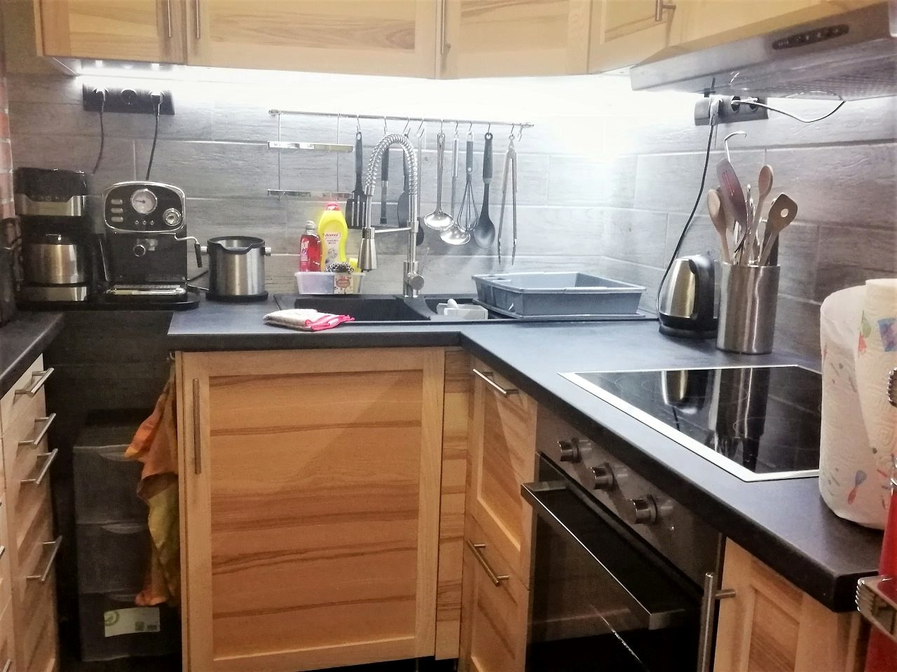 The kitchen counter with sink and oven