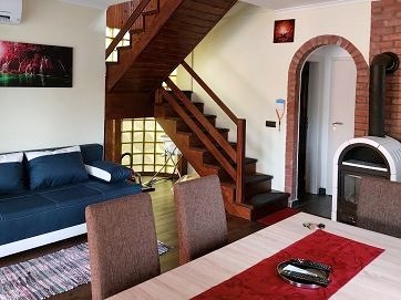 The living room from the brick arch and the fireplace