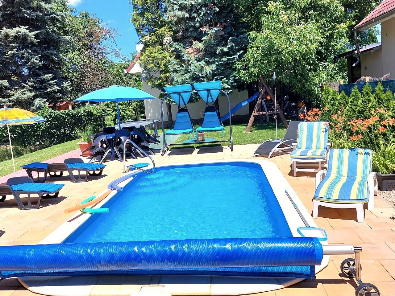 The pool with parasols and loungers, in summer